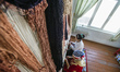 Women weave the silk carpet at the Samarkand-Bukhara Silk Carpets workshop, Samarkand, Uzb...