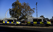 Police vans are pictured against the backdrop of the London Eye on November 17, 2018 in Lo...