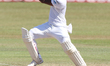 Sri Lankan cricketer Dimuth Karunaratne plays a shot during the 2nd day's play in the 3rd...