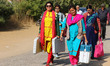 Election officials leaves after collecting their Electronic Voting Machine (EVM) from an E...