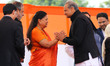 New Rajasthan Chief Minister Ashok Gehlot is greeted by Former Chief Minister Vasundhara R...