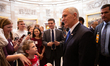 Vice President Mike Pence walks through the Capitol greeting visitors after a ceremonial s...