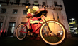 A 30-feet statue of Santa Claus with cyclist gloves and a bicycle that was placed as Chris...