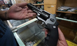 People watch guns at the Top Gun shop in downtown São Paulo, Brazil, on 21 January 2019. T...