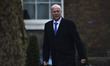 Transport Secretary Chris Grayling arrives for the weekly cabinet meeting at Downing Stree...