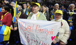 Participants hold a banner reading like "Yulia,save Ukraine!" in support of Yulia Tymoshen...