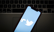 The Twitter logo is seen on a portable mobile device in this photo illustration on January...