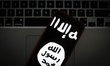 The Islamic State logo is seen on a portable mobile device in this photo illustration on J...