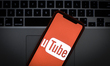The YouTube logo is seen on a portable mobile device in this photo illustration on January...