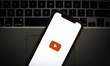 The YouTube logo is seen on a portable mobile device in this photo illustration on January...