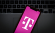 The T-Mobile logo is seen on a portable mobile device in this photo illustration on Januar...