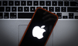 The Apple logo is seen on a portable mobile device in this photo illustration on January 2...