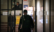 A policeman exits the main entrance of state run news broadcaster TVP in Warsaw, Poland on...