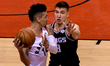  Danny Green #14 of the Toronto Raptors against Bogdan Bogdanovic #8 of the Sacramento Kin...