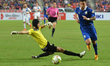 Charyl Chappuis (R) of Thailand is closed down by Philippines goalkeeper Patrick Deyto dur...