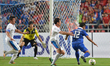Prakit Deeporm (R) of Thailand is closed down by Philippines players during the AFF Suzuki...