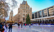 Ice skating rink in London during Christmas time, with decoration in the mood. Evening out...