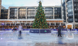 Ice skating rink in London during Christmas time, with decoration in the mood. Evening out...