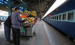 A Vendor Selling Fruits waits for the Customers on a Platform at new Delhi Railway Station...