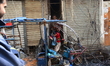 Bangladeshi rescue worker inspects a burnt building following a fire in Dhaka, Bangladesh'...