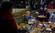 Pitha makers from all over the city gathered to sell their traditional pithas in Dhaka, Ba...