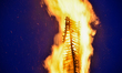 People gathered around 12.5 m tall bonfire on Shrove Sunday, also known as Cheesefare Sund...
