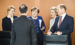 German Chancellor Angela Merkel (C) chats with Ministers prior to the weekly Cabinet meeti...