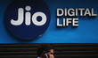 A man walks past in front of a Reliance Jio Infocomm Ltd’s store in Mumbai, India on 13 Ma...