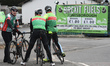 A group of cyclists stops near a Brexit Fuels sign seen in Jonesborough village, near the...