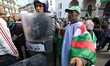  Algerians shout slogans during a protest against interim President Abdelkader Bensalah, i...