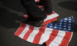 Iranians set ablaze a US flag during an anti-US rally following Friday prayers in Tehran o...