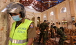 Sri Lankan military officers conduct inspections and repairs inside the St. Sebastians chu...