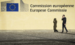 Pedastrian is walking with a phone in front of   the EU Commission headquarters in Brussel...