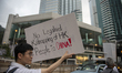 A man holds up a banner which reads No legalised kidnapping of HK People to china during a...