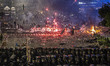 Protesters clash with Indonesian riot police during a demonstration in front of the Electi...
