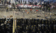Protesters clash with Indonesian riot police during a demonstration in front of the Electi...