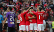Benfica's defender Jardel Vieira (not seen) celebrates with teammates after scoring the op...