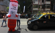 A mascot dressed in cigarette costume urges people to quit smoking on the occasion of Worl...