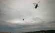 U.S. Army military helicopters seen over Omaha Beach near Colleville-sur-Mer, on Sunday, J...