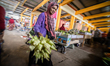 Indonesian shop for various needs at a traditional market ahead of Eid Al-Fitr or Lebaran...
