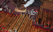 A flute maker making flute on February 20, 2015 in Dhaka, Bangladesh. 