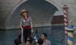 Gondolier sails at the  Italian-themed shopping mall at Venetian Hotel an Casinoin Macau,...