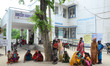 Indian local women of Minapur village wait with their children for the checkup of  AES (Ac...