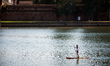 A man uses a paddle on the Garonne river during the heatwave. An intense heatwave is on We...