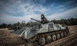 Cadet sits in his BMP-1 infantry fighting vehicle, which he calls 'Snizhok' (Snowball), du...