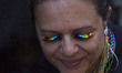 A spectator wears rainbow eyelashes at the annual Pride Parade on Sunday, June 29, 2019 in...
