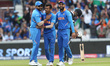 India's Yuzvendra Chahal celebrates with Rohit Sharma and Virat Kohli after dismissing New...
