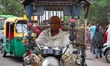 Firdous, 36, a lady rickshaw driver who feeds a family of three waits for the passengers o...