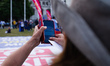A woman takes a photograph of a 'Stop Brexit' banner as demonstrators gather for a rally i...