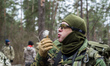 Soldier blows at the flower at training center 'Patriot', Kyiv, Ukraine. 15 of March, 2015...